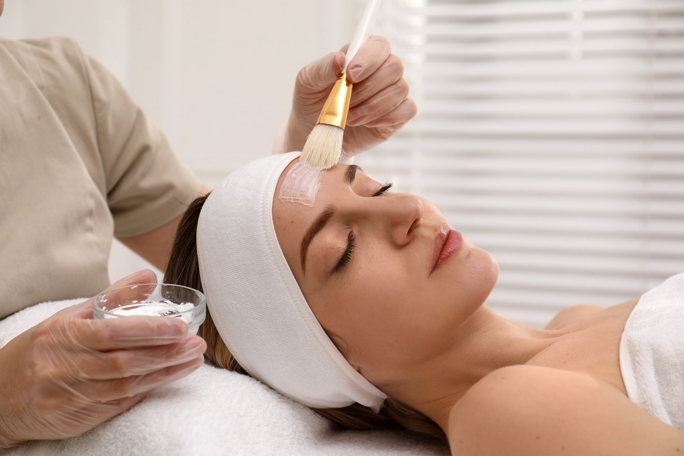 Young Woman during Face Peeling Procedure in Salon